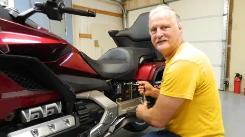 The author working on a red Honda Gold Wing